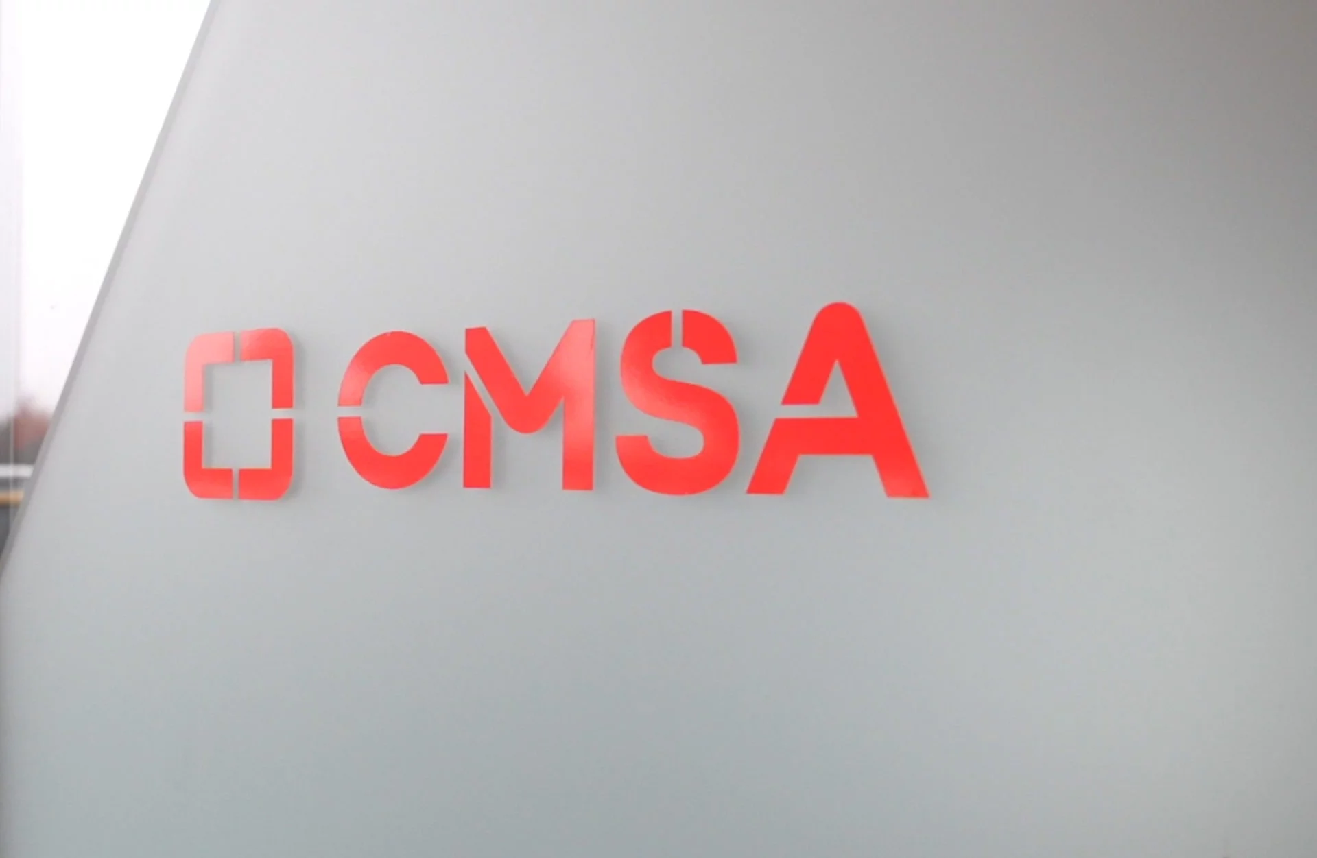 CMSA logo sticker on sliding door